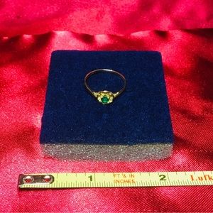 Genuine emerald and 10 K gold ring. Approximate size is 4-4.5.